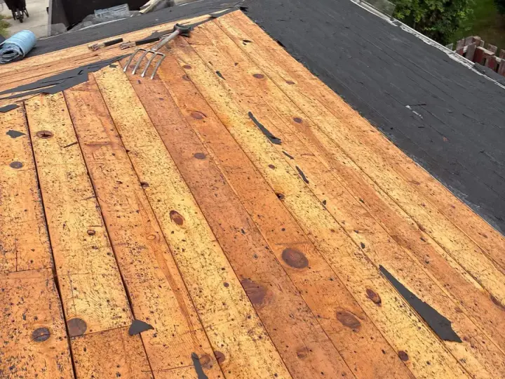 Exposed wood roof decking during shingle tear-off