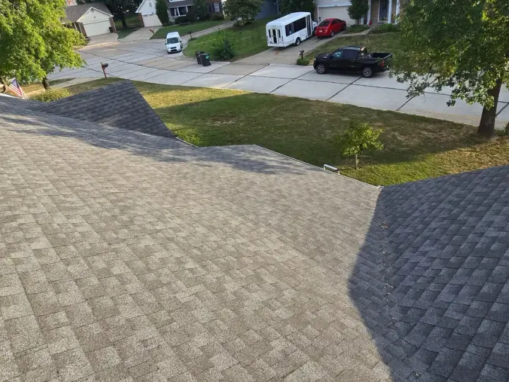 Wide view of architectural shingles, roof slopes and a valley